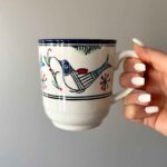 Price and Buy Artistic Ceramic Cup – Handcrafted with White Bird and Flower Painted Design - Image 3