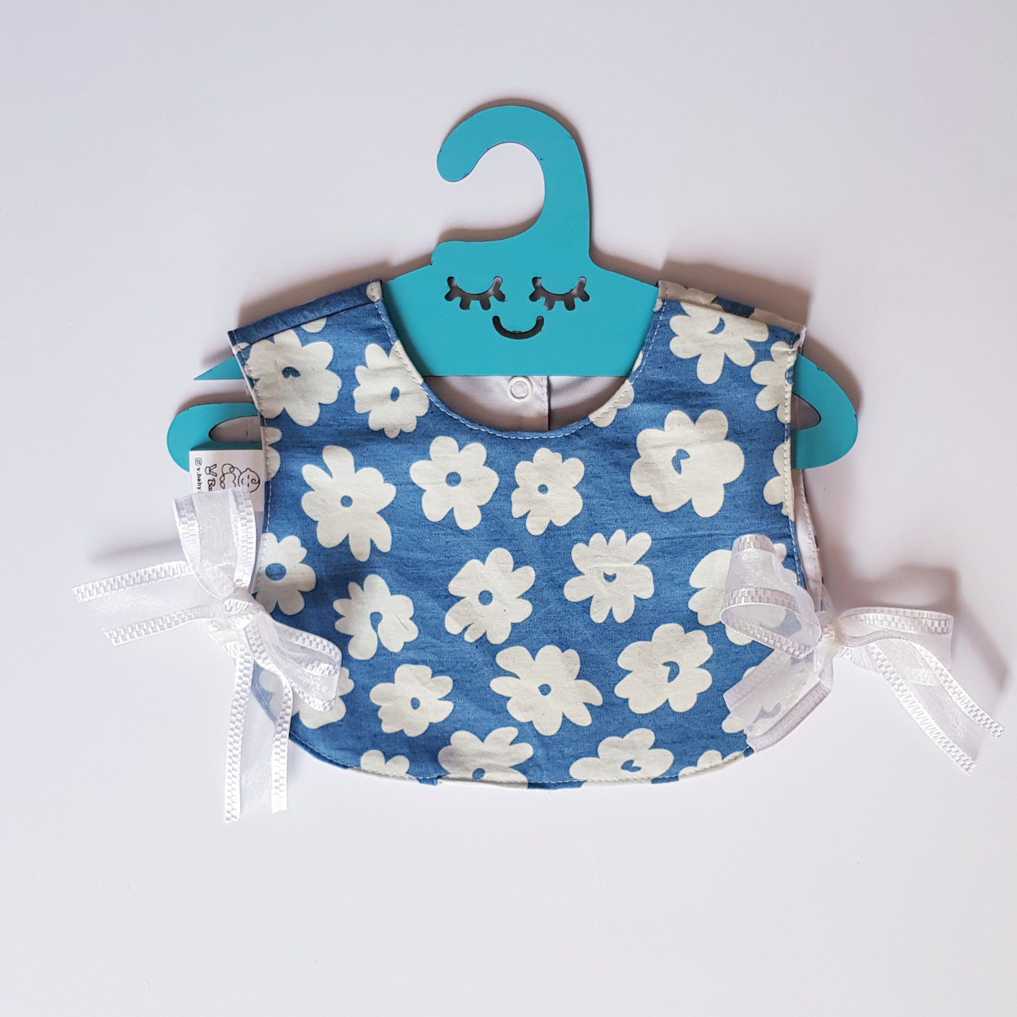 Price and Buy Baby Bib – Sweet Floral Style with Cute Hanger Detail_690238eb1921b.jpeg Price and Buy Baby Bib – Sweet Floral Style with Cute Hanger Detail - Image 1