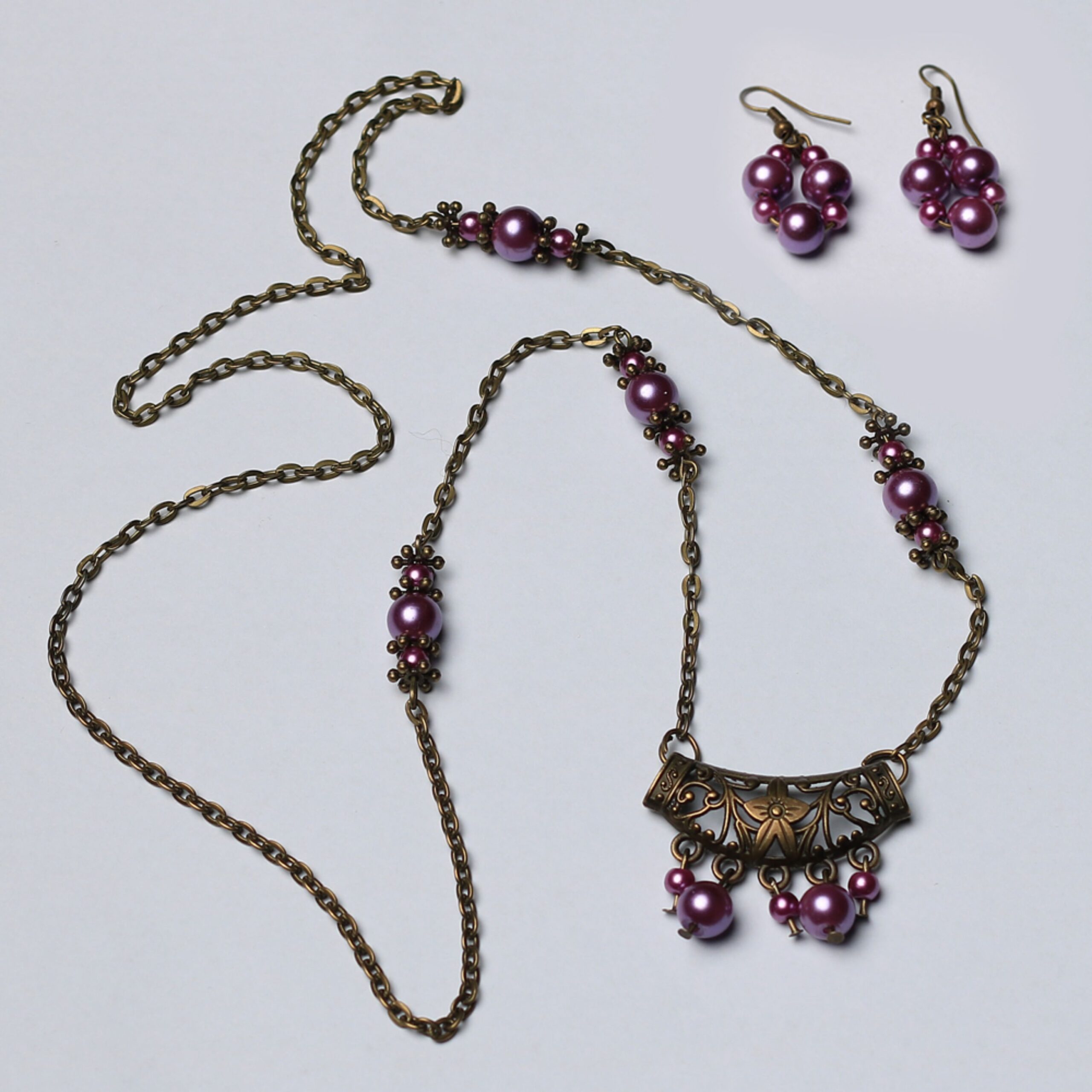 Price and Buy Bronze Jewelry Set Chain Necklace with Purple Pearl & Matching Earring_690253c3ee372.jpeg Price and Buy Bronze Jewelry Set Chain Necklace with Purple Pearl & Matching Earring - Image 1