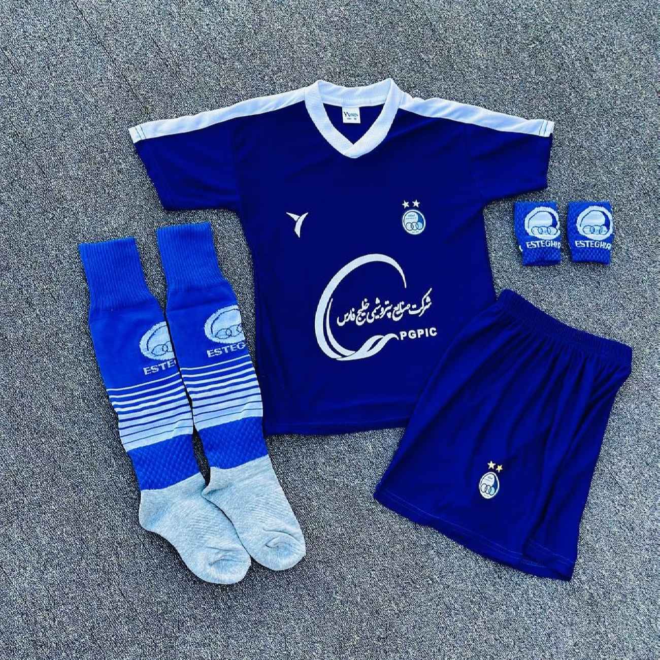 Price and Buy Esteghlal FC Fan Jersey Collection With Socks & Wristbands For Kids (4x)_690341c8cc86d.jpeg Price and Buy Esteghlal FC Fan Jersey Collection With Socks & Wristbands For Kids (4x) - Image 1
