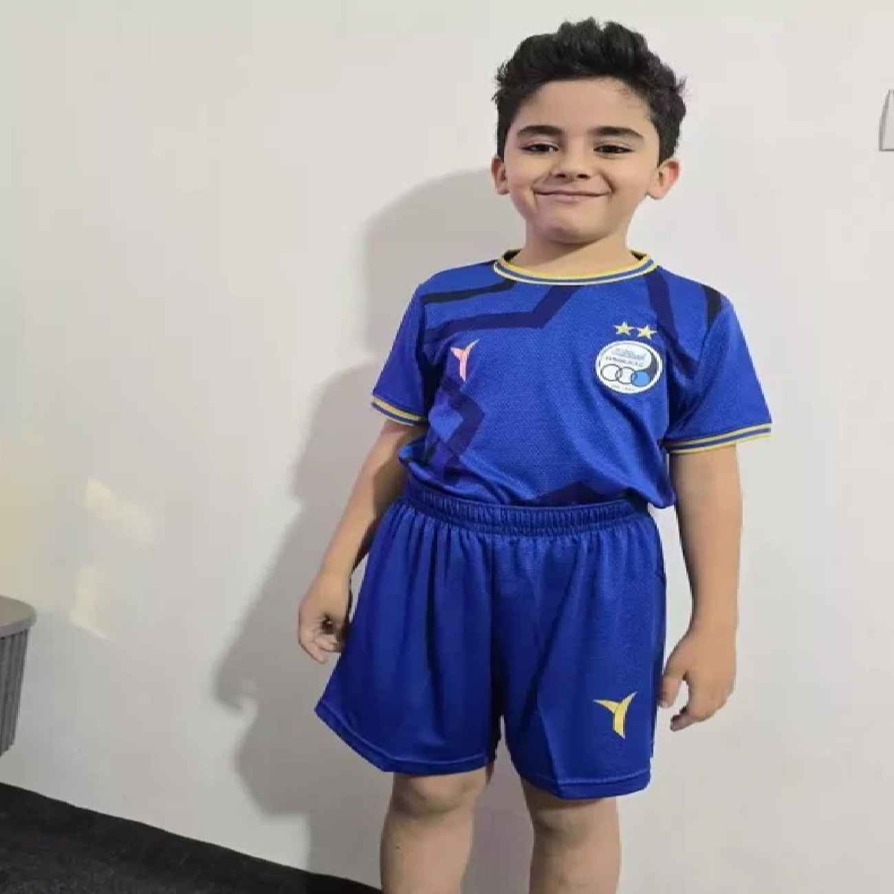 Price and Buy Esteghlal Jersey with Short Set Sport Soccer – Suitable for Kids_690285d5b7762.jpeg Price and Buy Esteghlal Jersey with Short Set Sport Soccer – Suitable for Kids - Image 1