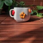 Price and Buy Handcrafted Embossed Floral Ceramic Mug – Fantasy Style with Raised Flower Design - Image 4