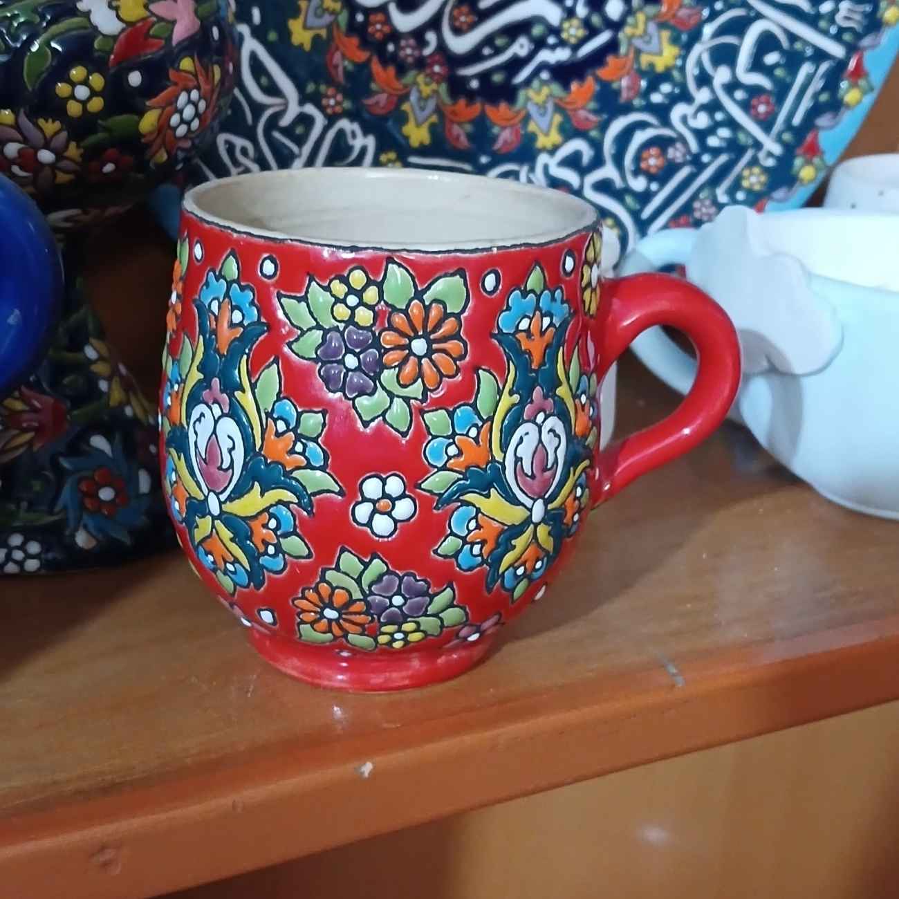 Price and Buy Handmade Coffee Mug – Enamel-Finished Pottery, with Floral Design in Red_69031ac99a82e.jpeg Price and Buy Handmade Coffee Mug – Enamel-Finished Pottery, with Floral Design in Red - Image 1