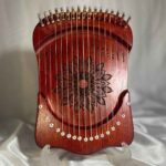 Price and Buy Harika 16-String Mahogany Lyre Harp Mandala Engraved Melody in a Rich Wood Tone
