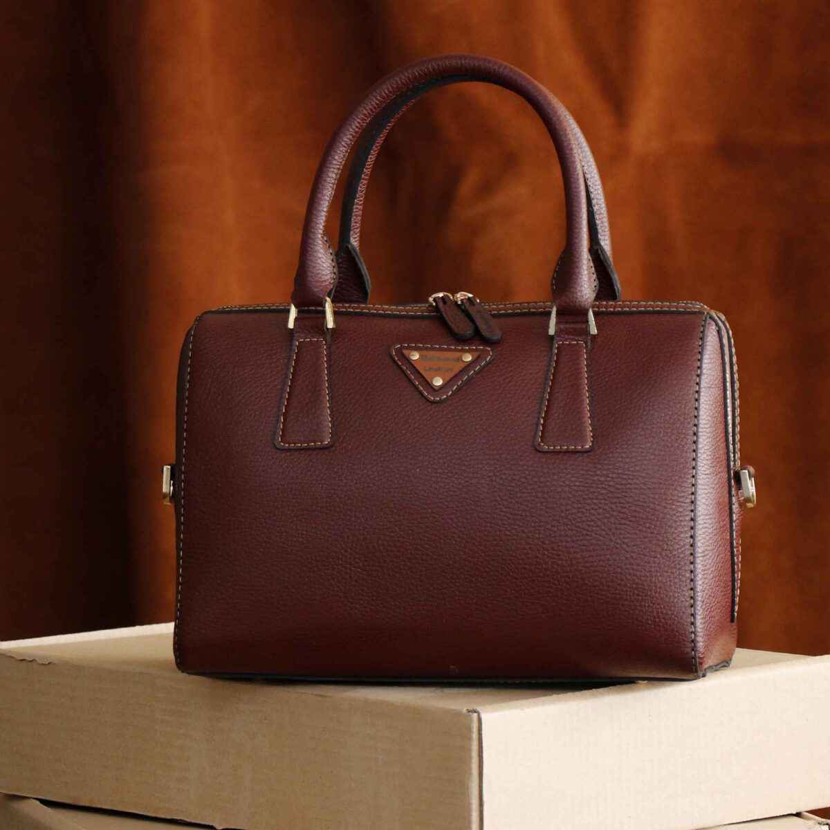 Price and Buy Leather Bauletto Handbag with Top Handle & Large Capacity - Image 7